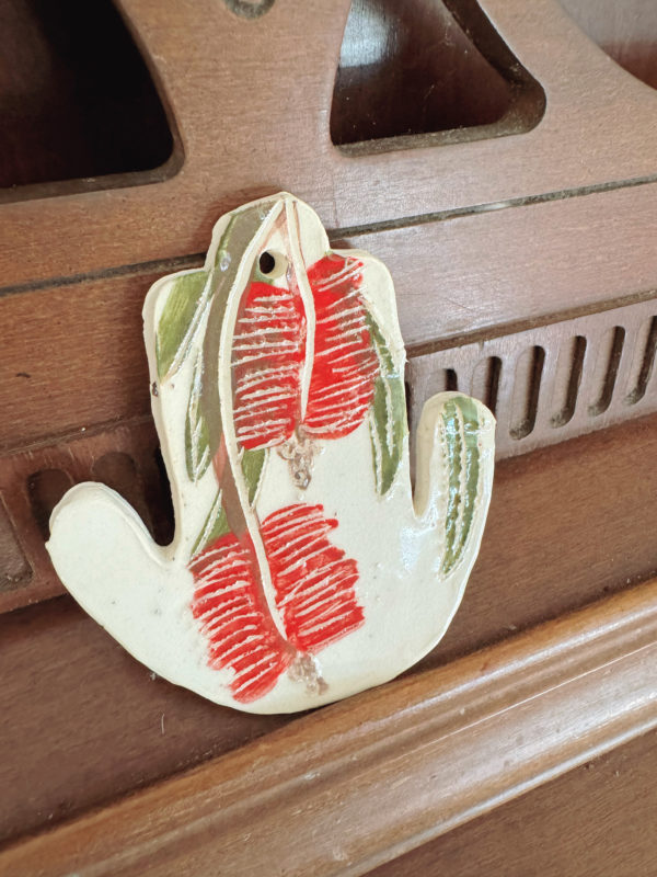 ceramic hamsa with sgraffito bottlebrush design