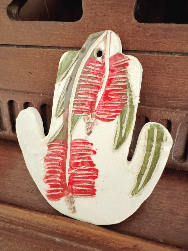 ceramic hamsa with sgraffito bottlebrush design