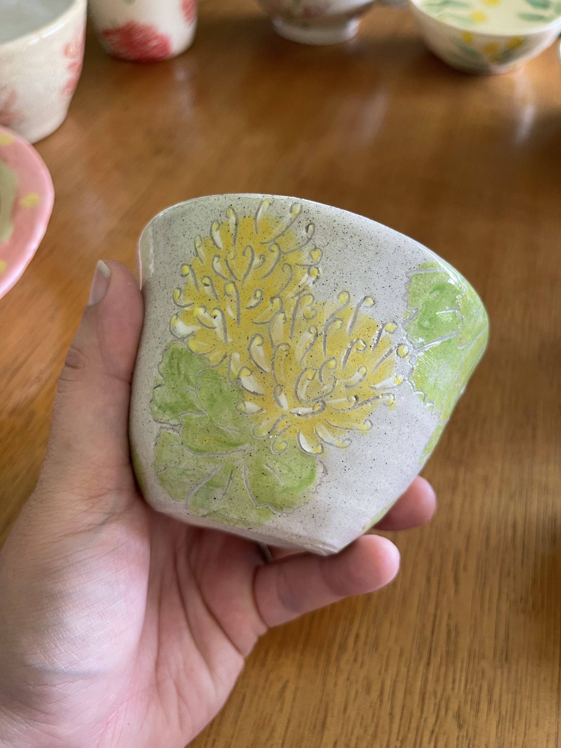 Yellow Grevillea sgraffito mug on grey speckle clay